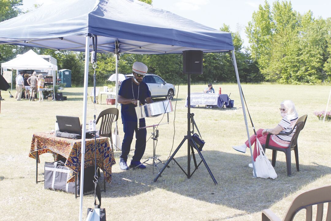 Talented artist performs at Farmers' Market